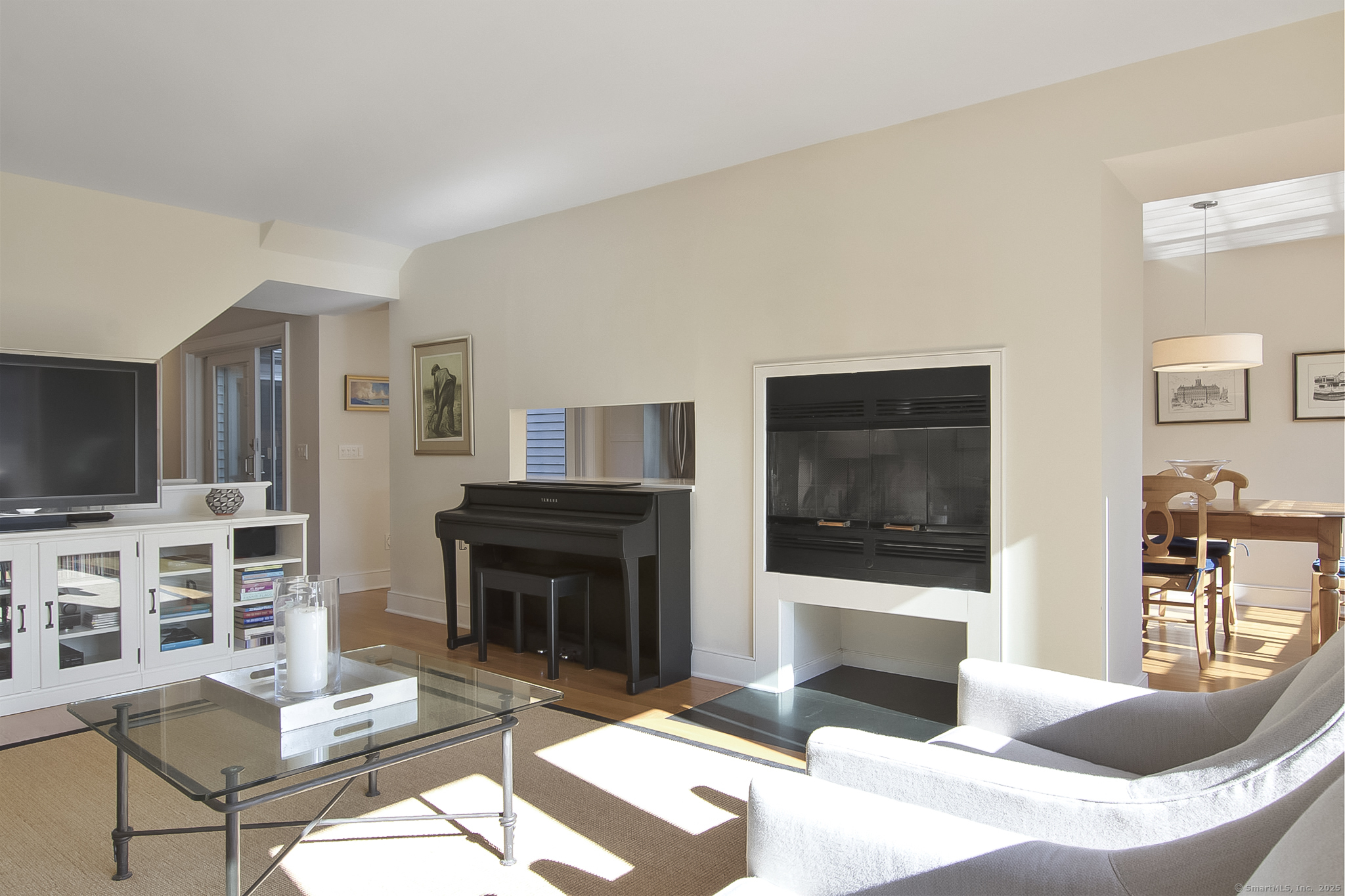 20 Wilton Crest, Unit 20 Wilton, CT 06897 - Photo 15 of 40 a living room with furniture a flat screen tv and a fireplace