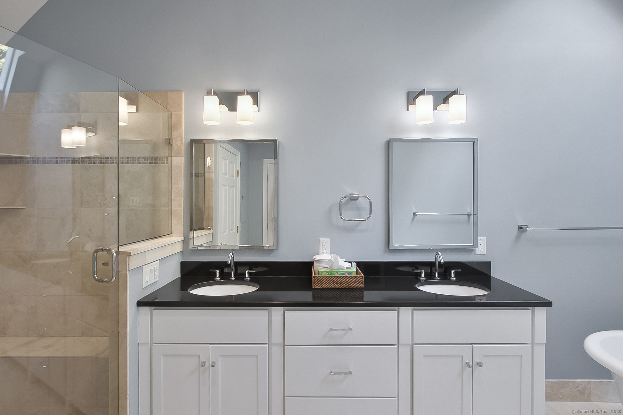20 Wilton Crest, Unit 20 Wilton, CT 06897 - Photo 19 of 40 a bathroom with double sink and a mirror