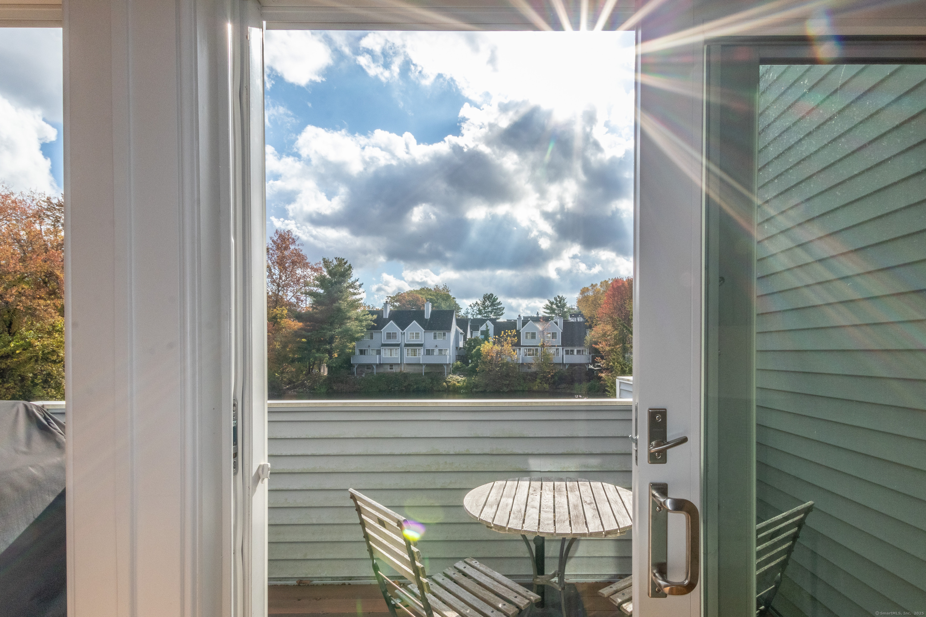 20 Wilton Crest, Unit 20 Wilton, CT 06897 - Photo 2 of 40 a balcony with table and chairs