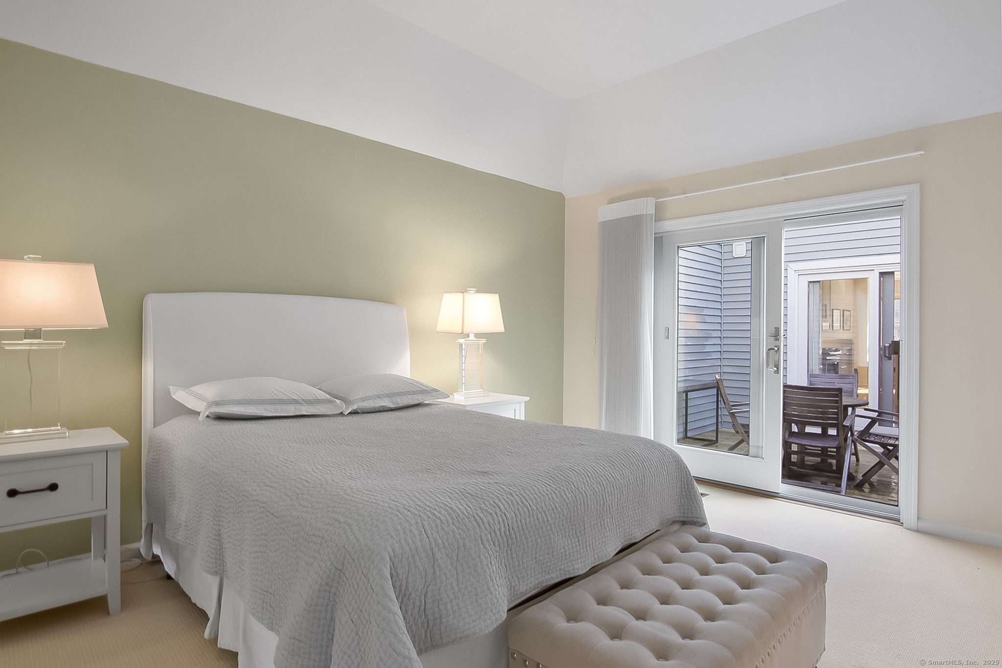 20 Wilton Crest, Unit 20 Wilton, CT 06897 - Photo 21 of 40 a bedroom with a bed and a couch