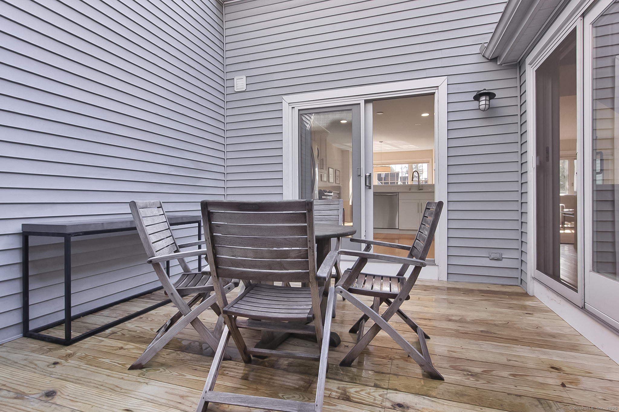 20 Wilton Crest, Unit 20 Wilton, CT 06897 - Photo 29 of 40 a view of a wooden chairs in the balcony
