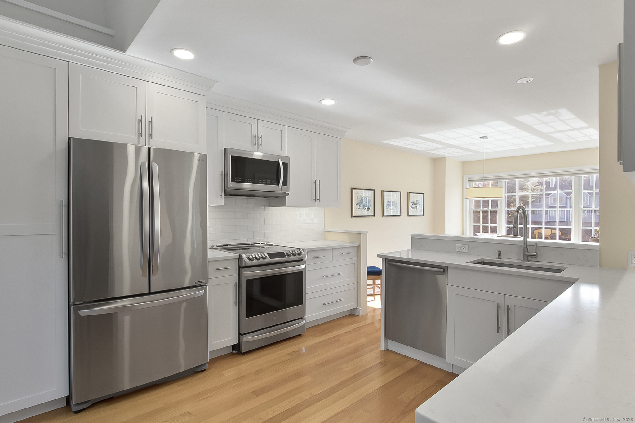 20 Wilton Crest, Unit 20 Wilton, CT 06897 - Photo 3 of 40 a kitchen with stainless steel appliances granite countertop a refrigerator stove and sink