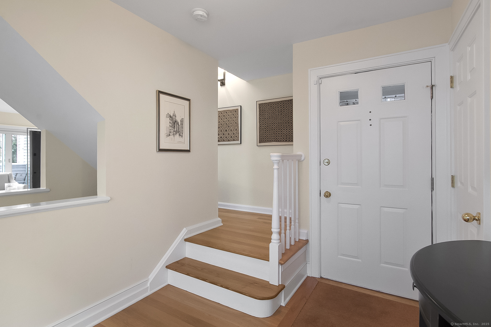 20 Wilton Crest, Unit 20 Wilton, CT 06897 - Photo 32 of 40 a view of entryway with wooden floor and window