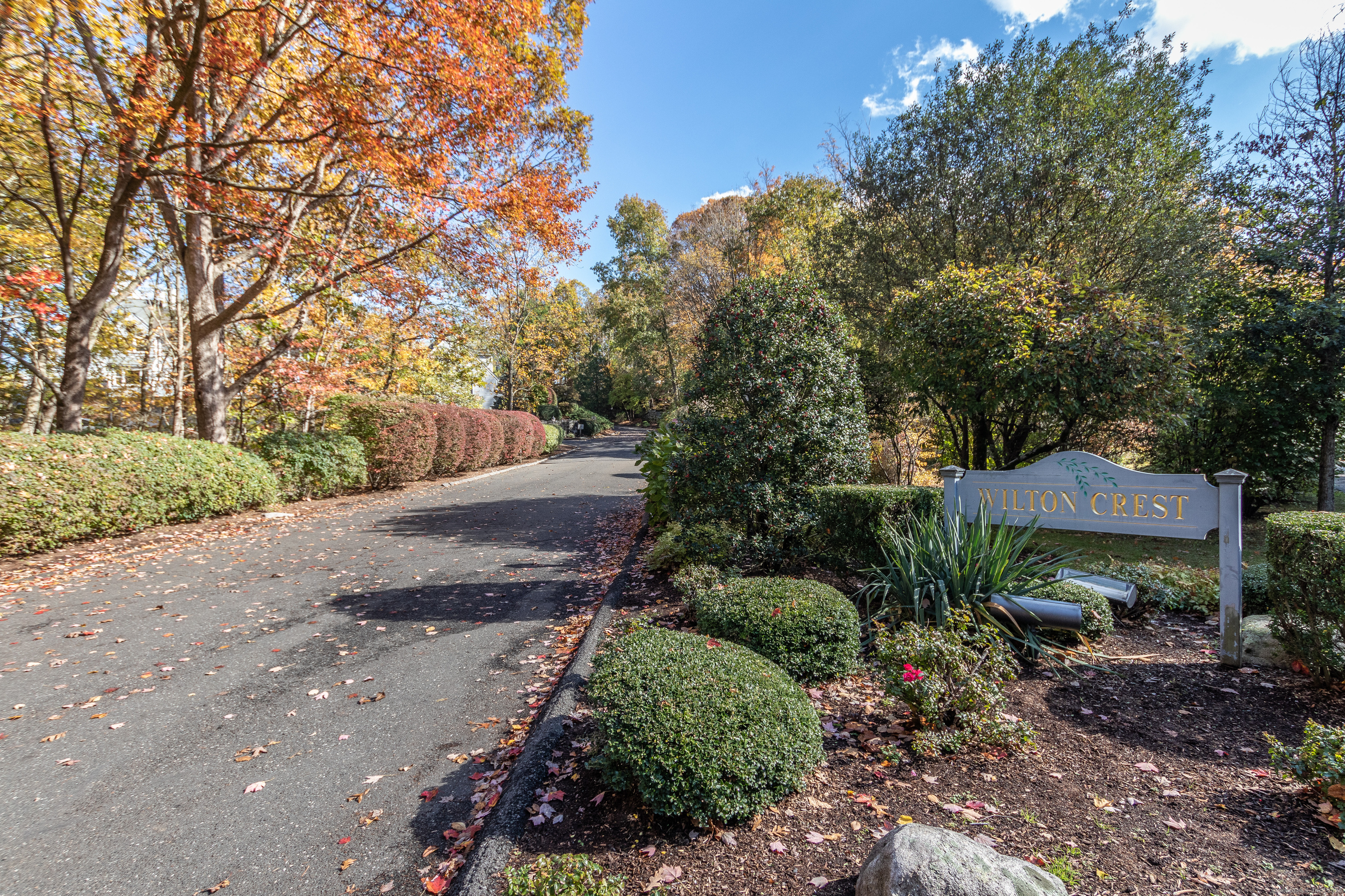 20 Wilton Crest, Unit 20 Wilton, CT 06897 - Photo 37 of 40 a view of a street with a house in the background