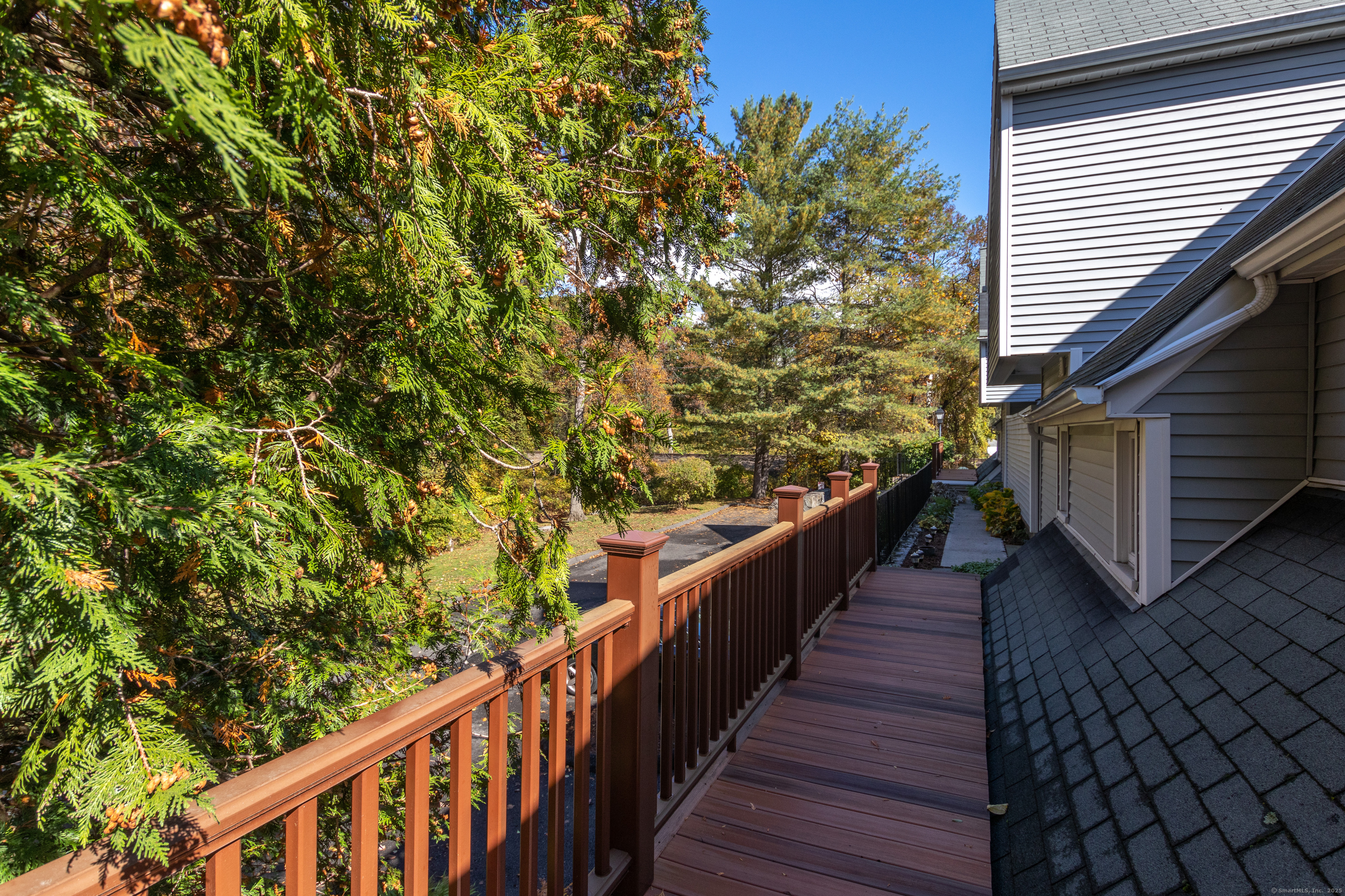 20 Wilton Crest, Unit 20 Wilton, CT 06897 - Photo 38 of 40 a view of a balcony with wooden stairs