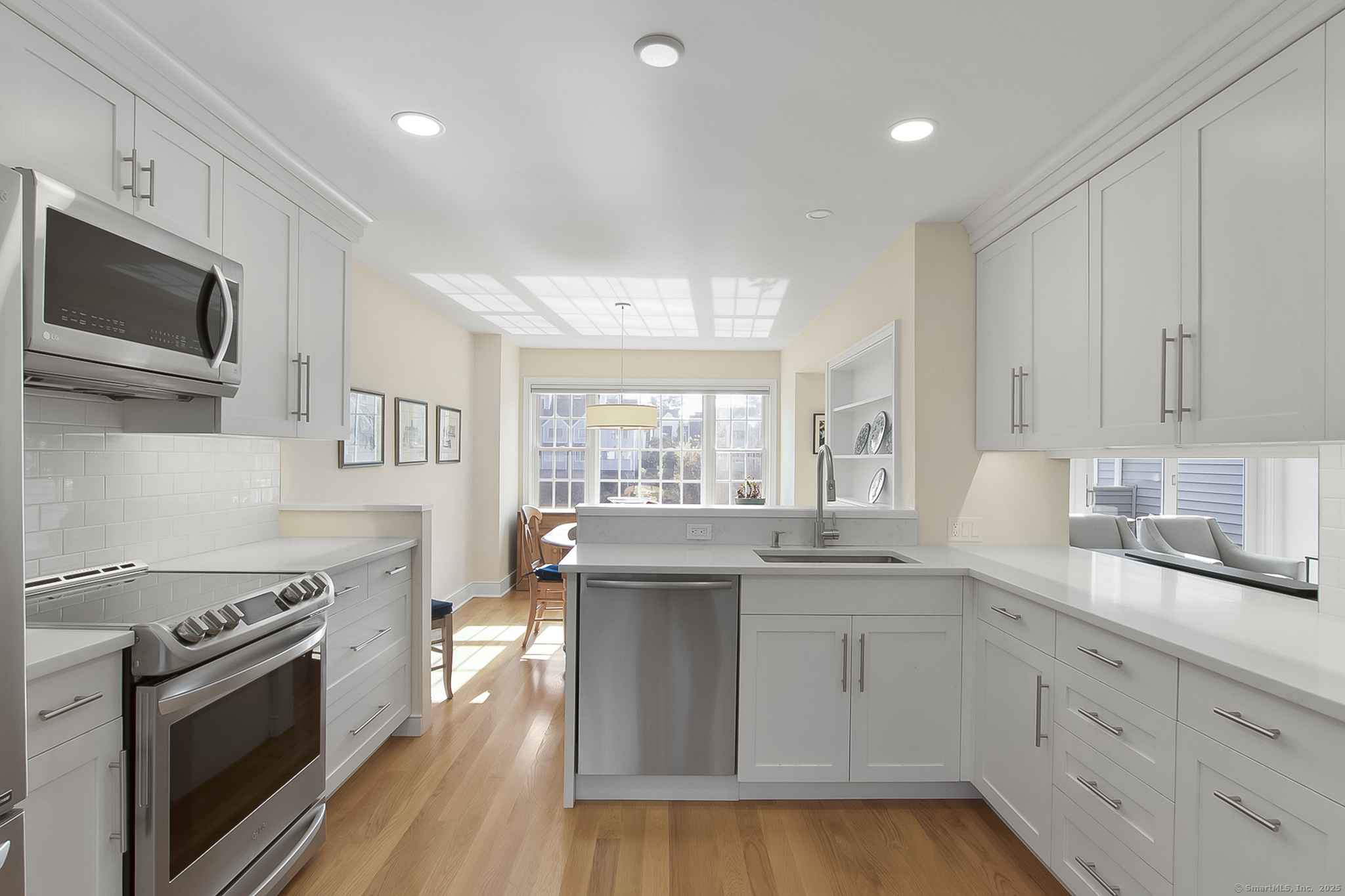 20 Wilton Crest, Unit 20 Wilton, CT 06897 - Photo 4 of 40 a kitchen with stainless steel appliances granite countertop a stove and a sink