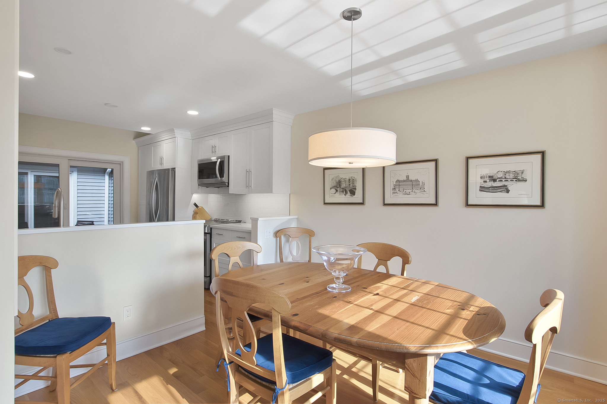 20 Wilton Crest, Unit 20 Wilton, CT 06897 - Photo 10 of 40 a view of a dining room with furniture and wooden floor