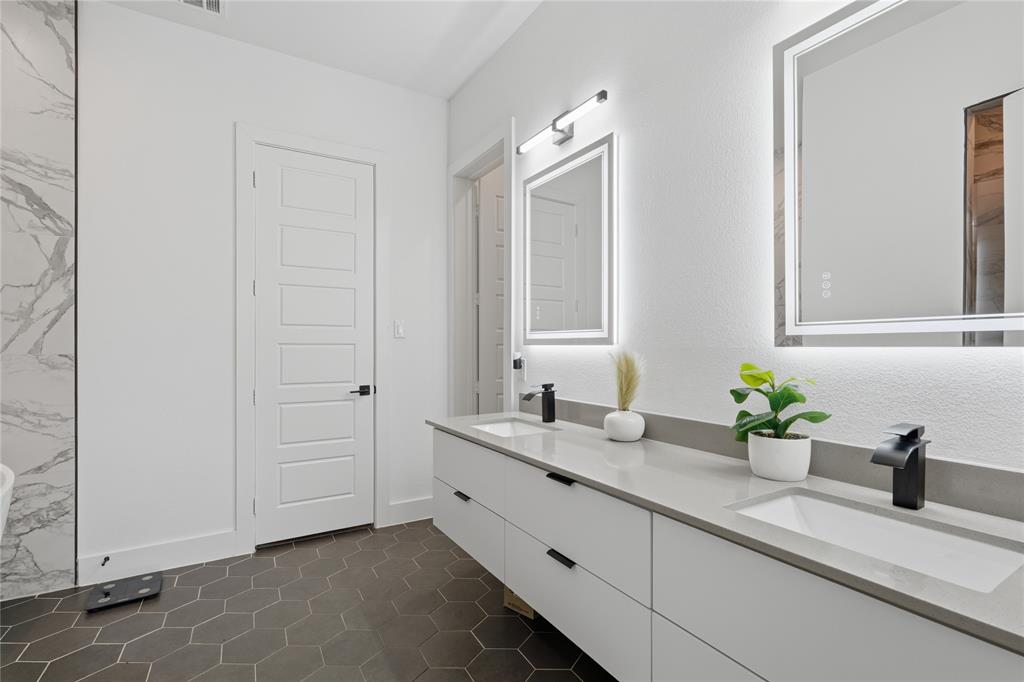3316 Nomas Street Dallas, TX 75212 - Photo 13 of 27 a bathroom with a double vanity sink and a mirror