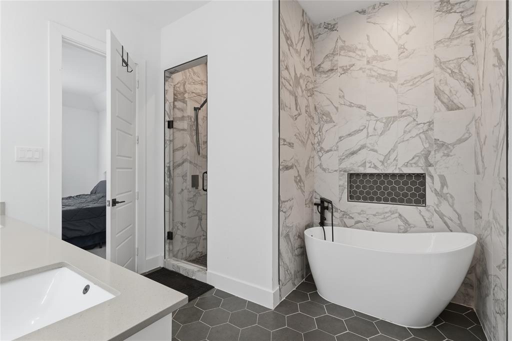 3316 Nomas Street Dallas, TX 75212 - Photo 14 of 27 a bathroom with a bathtub and shower