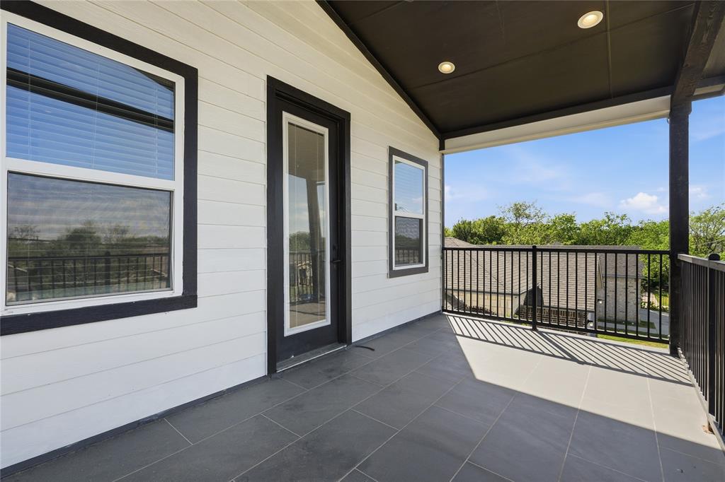 3316 Nomas Street Dallas, TX 75212 - Photo 19 of 27 a view of a balcony with a floor to ceiling window