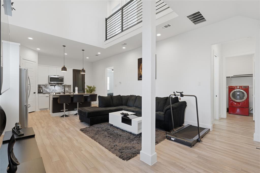 3316 Nomas Street Dallas, TX 75212 - Photo 4 of 27 a living room with furniture and a gym machine