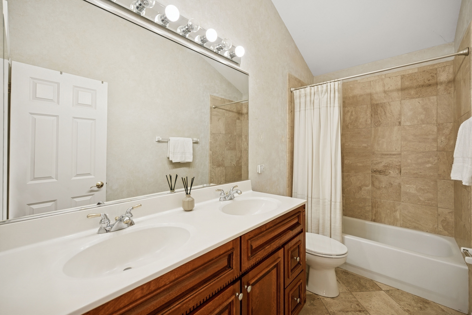 1725 Annapolis Drive Glenview, IL 60026 - Photo 24 of 38 a bathroom with a sink a toilet a mirror and shower