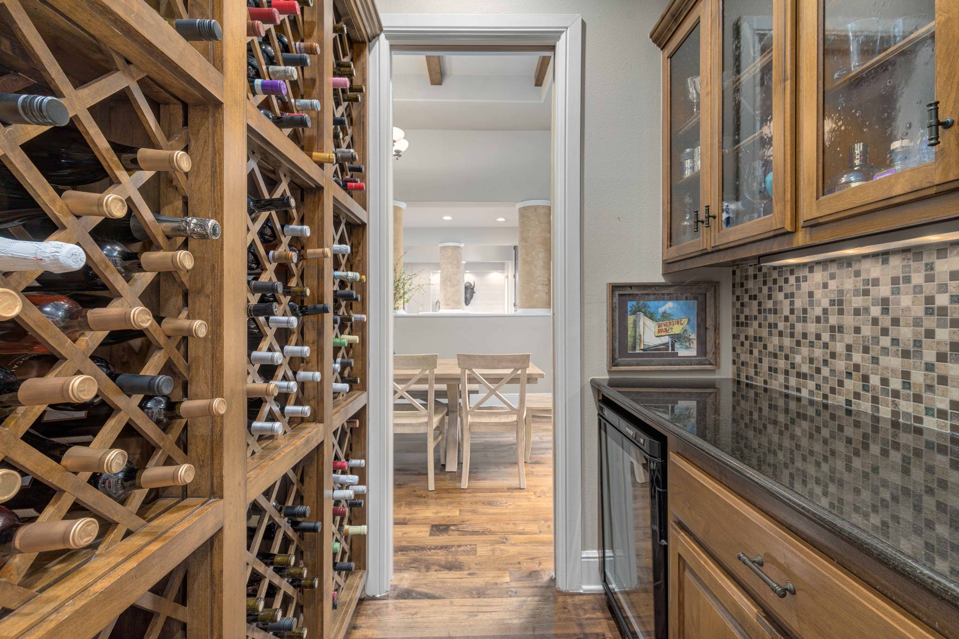 9104 Atwater Cove Austin, TX 78733 - Photo 13 of 36 Wine cellar with dark wood finished floors and wine cooler