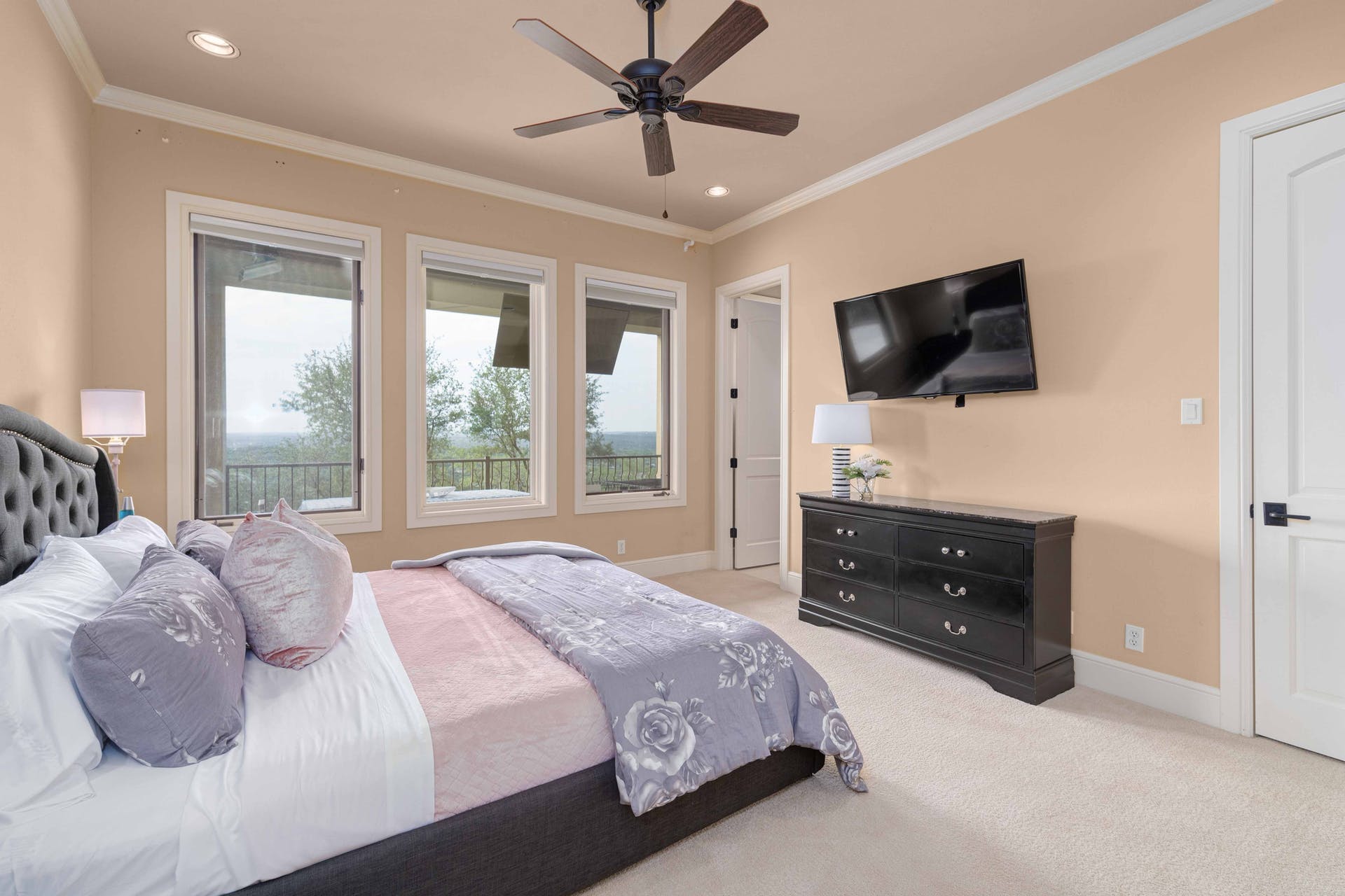 9104 Atwater Cove Austin, TX 78733 - Photo 22 of 36 Bedroom featuring light carpet, crown molding, a ceiling fan, and recessed lighting