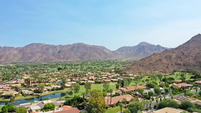 an aerial view of residential house and green space