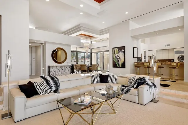a living room with fireplace furniture and a flat screen tv