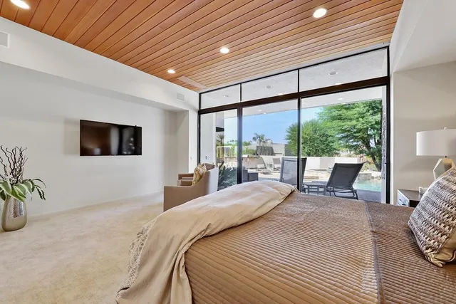 a large bathroom with a large tub and sink