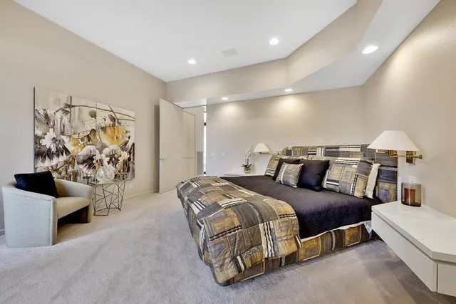 a bedroom with a bed and walk in closet