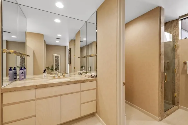a bathroom with a double vanity sink mirror and double