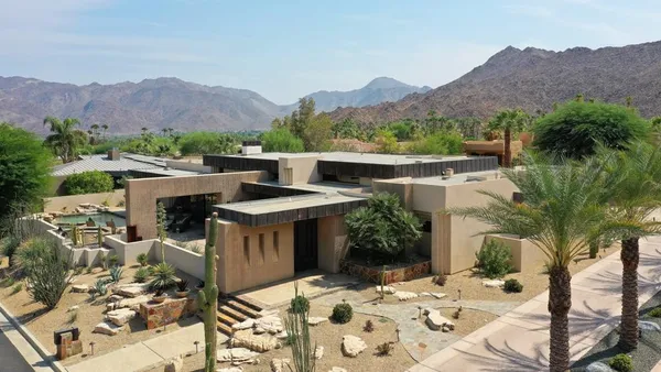 a view of an outdoor dining space with mountain view