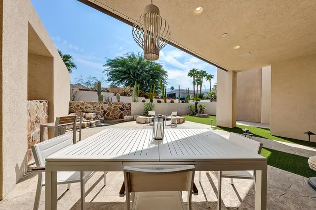 swimming pool view with a couple of trees