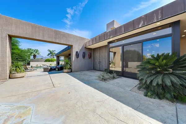 a view of a building with potted plants