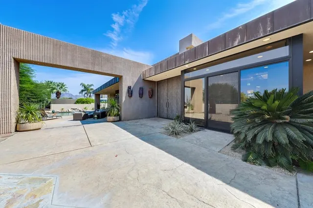a view of a building with potted plants