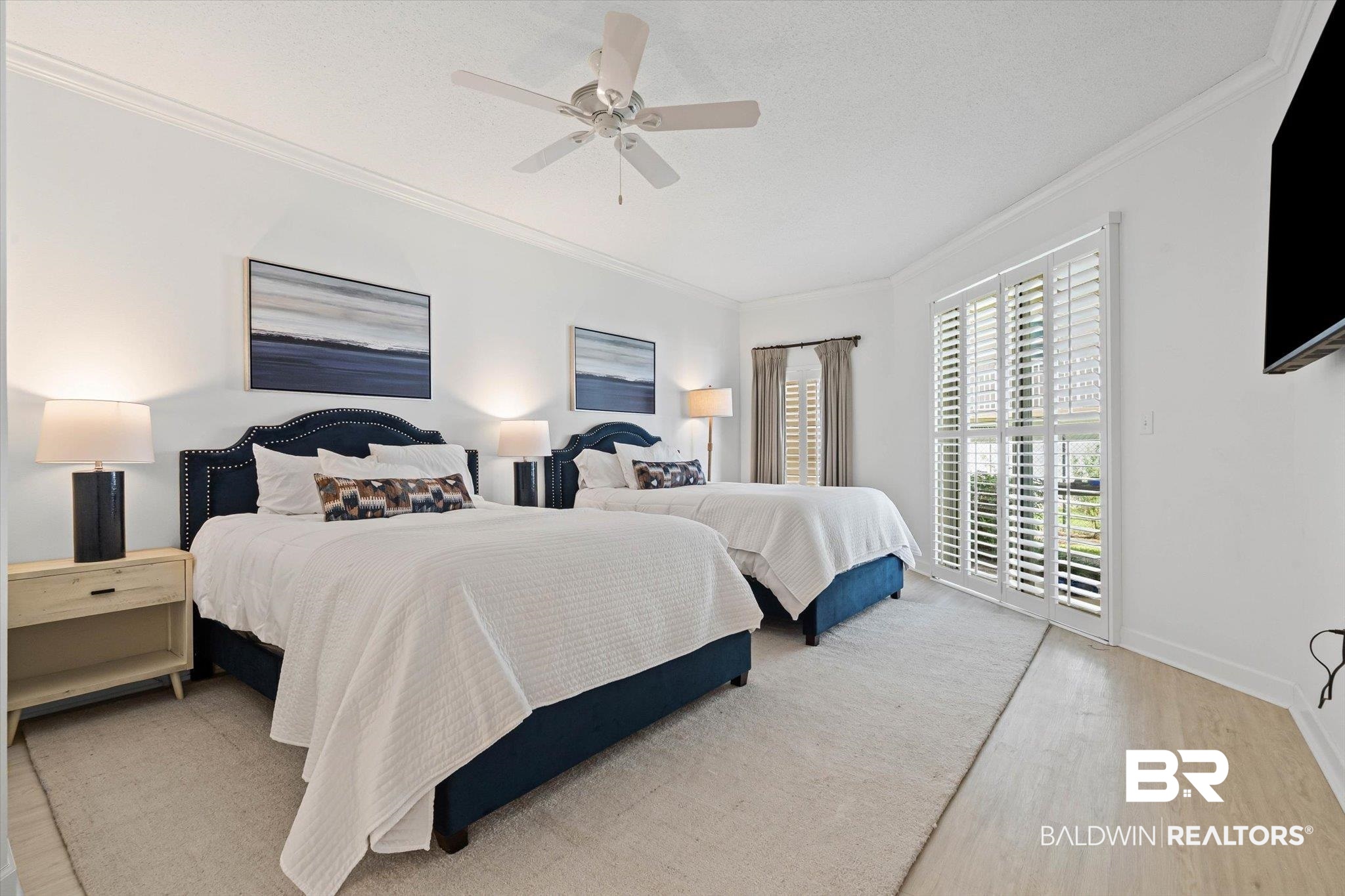 27770 Canal Road, Unit 2102 Orange Beach, AL 36561 - Photo 6 of 19 Bedroom with ornamental molding, access to exterior, a ceiling fan, wood finished floors, and a textured ceiling