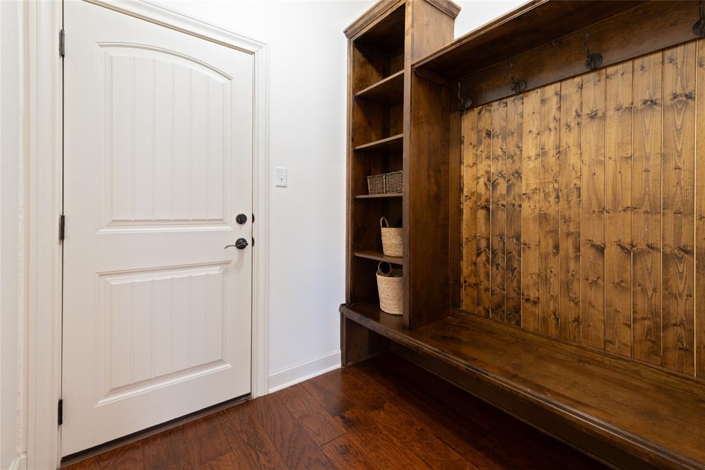 266 Weatherby Street Tuscola, TX 79562 - Photo 19 of 29 Mudroom featuring dark wood-type flooring and baseboards