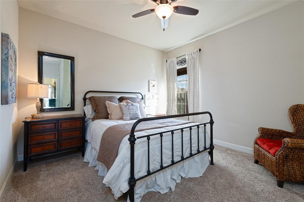 266 Weatherby Street Tuscola, TX 79562 - Photo 25 of 29 Carpeted bedroom with a ceiling fan and baseboards