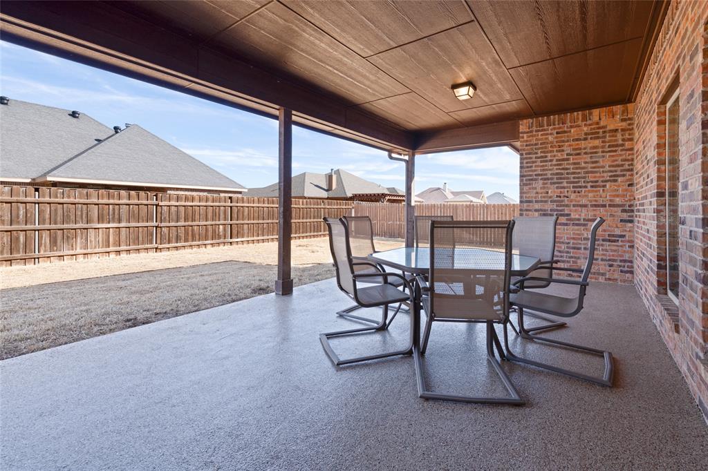 266 Weatherby Street Tuscola, TX 79562 - Photo 27 of 29 Fenced backyard with outdoor dining space and a patio area