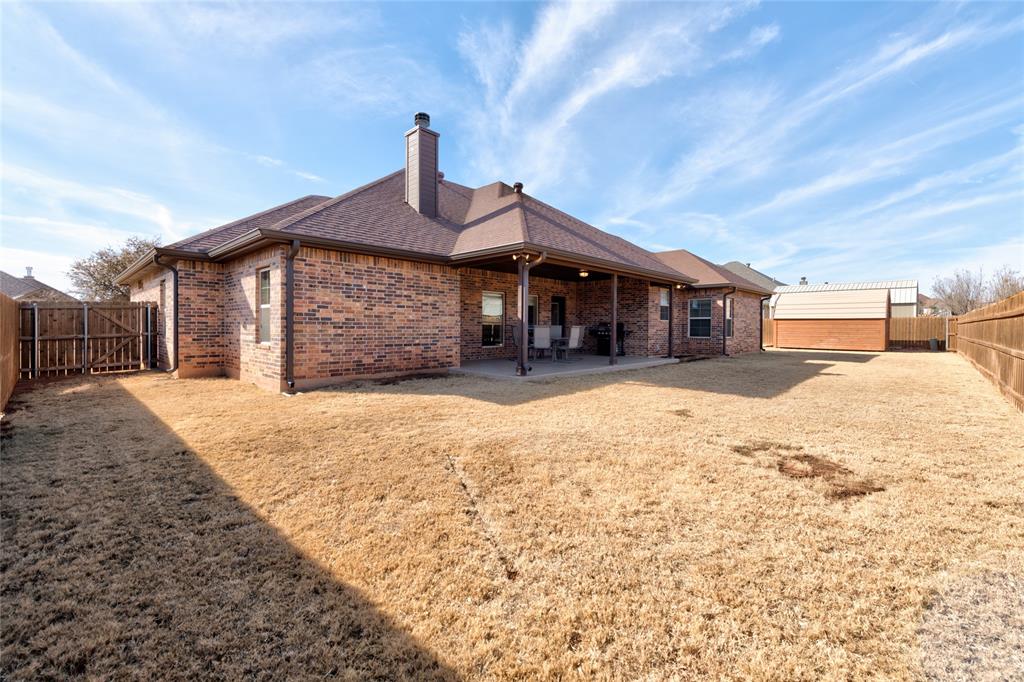 266 Weatherby Street Tuscola, TX 79562 - Photo 28 of 29 Rear view of property with a fenced backyard, brick siding, a patio, a gate, and roof with shingles