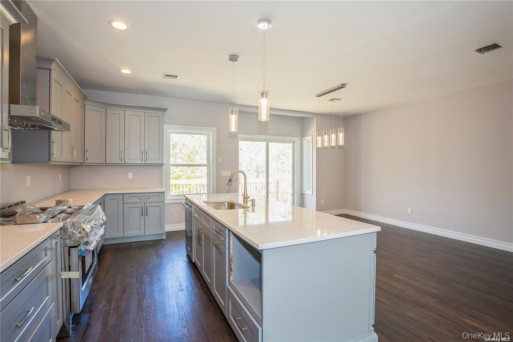 0 Hedda Road Port Jefferson Station, NY 11776 - Photo 4 of 8 a kitchen with a sink stove and cabinets
