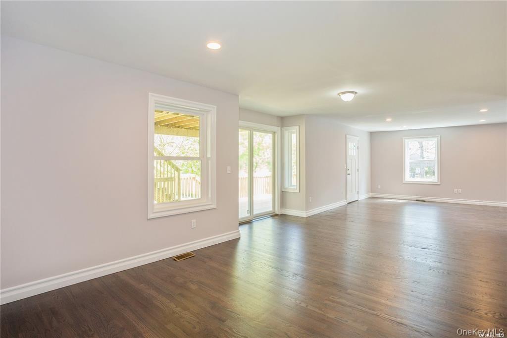 0 Hedda Road Port Jefferson Station, NY 11776 - Photo 5 of 8 an empty room with wooden floor and windows