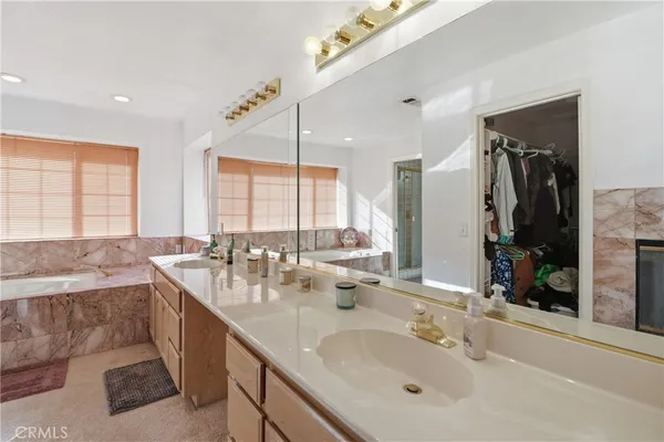 a bath tub sitting in a bathroom next to a window