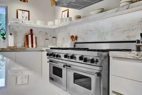 a kitchen with a stove and a sink