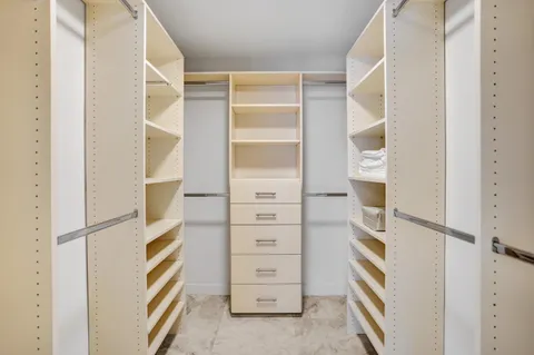 a utility room with closet dryer and washer