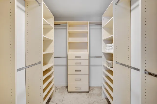 a utility room with closet dryer and washer