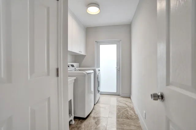 a bathroom with a double vanity sink and a mirror