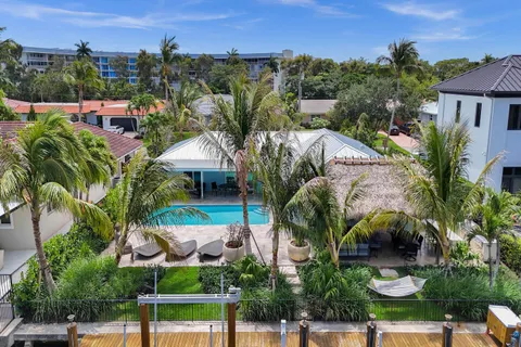 an aerial view of a house with outdoor space
