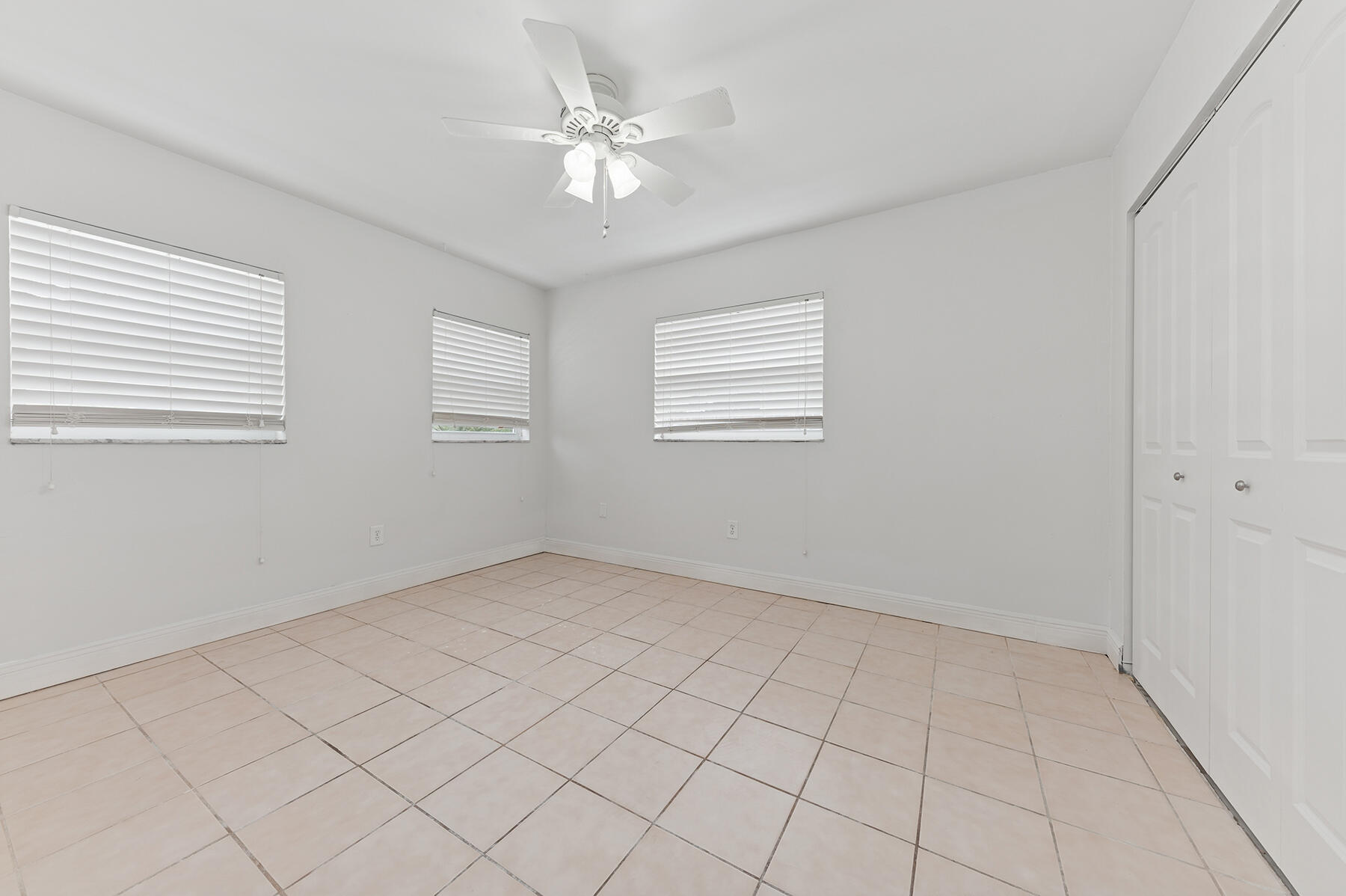 9220 Southwest 2nd Street Boca Raton, FL 33428 - Photo 11 of 16 a view of an empty room with a window