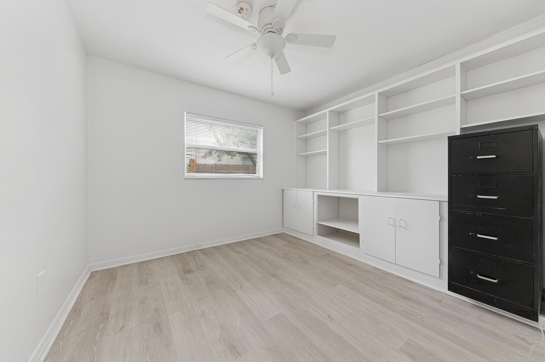 9220 Southwest 2nd Street Boca Raton, FL 33428 - Photo 13 of 16 an empty room with windows and cabinet