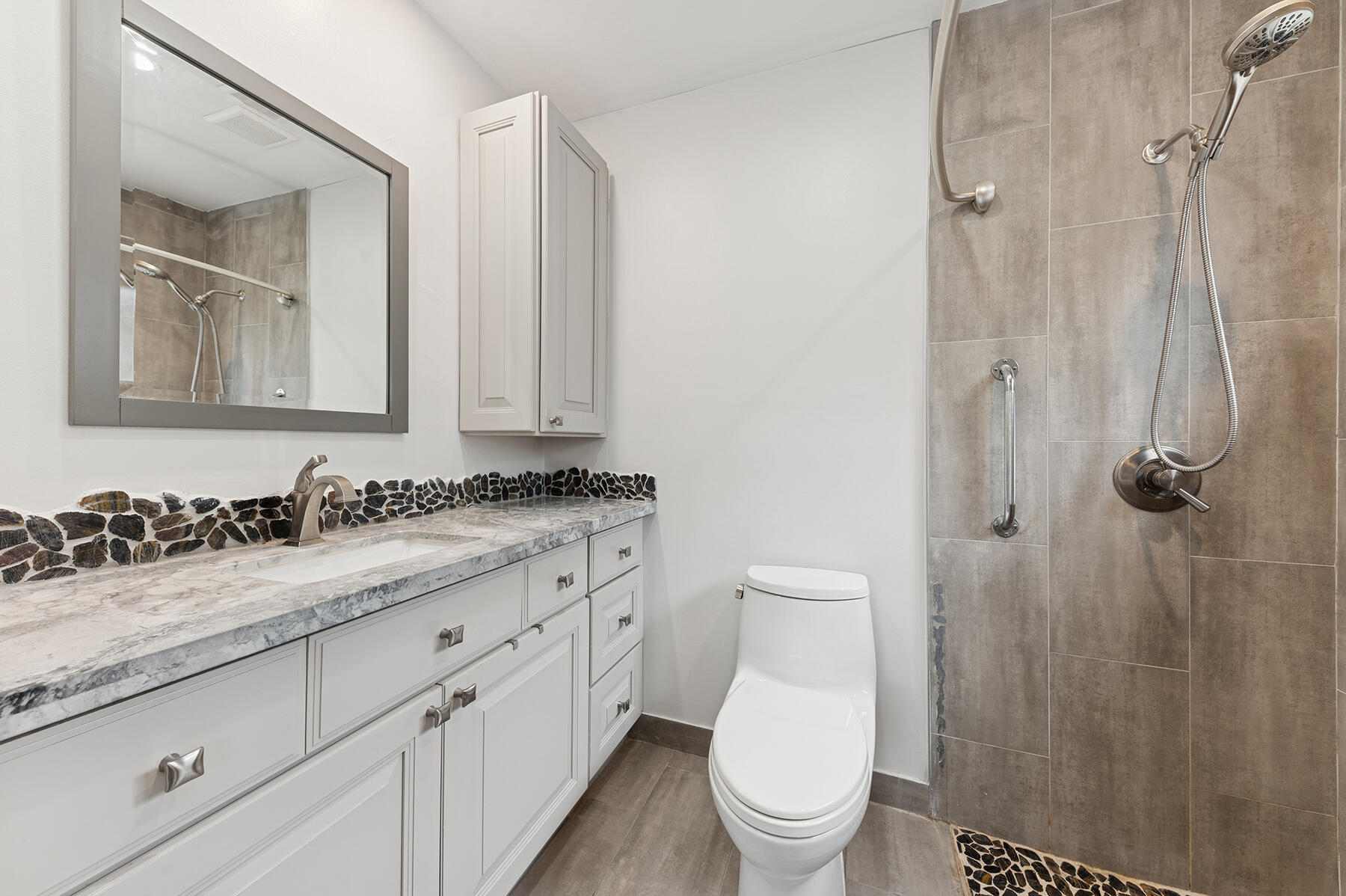 9220 Southwest 2nd Street Boca Raton, FL 33428 - Photo 10 of 16 a bathroom with a granite countertop sink mirror and toilet