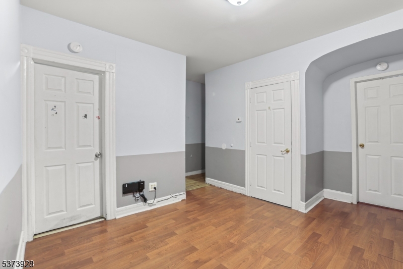 79 Irving Street Newark, NJ 07104 - Photo 19 of 30 an empty room with wooden floor