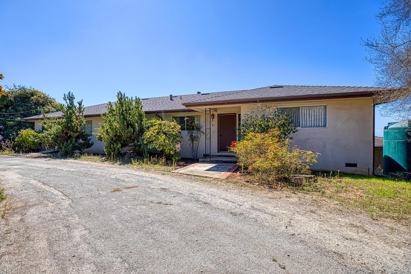 21 Lilly Way Watsonville, CA 95076 - Photo 17 of 47 front view of a house with potted plants