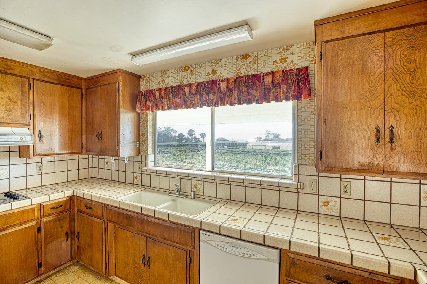 21 Lilly Way Watsonville, CA 95076 - Photo 19 of 47 a view of a kitchen with a sink and large windows