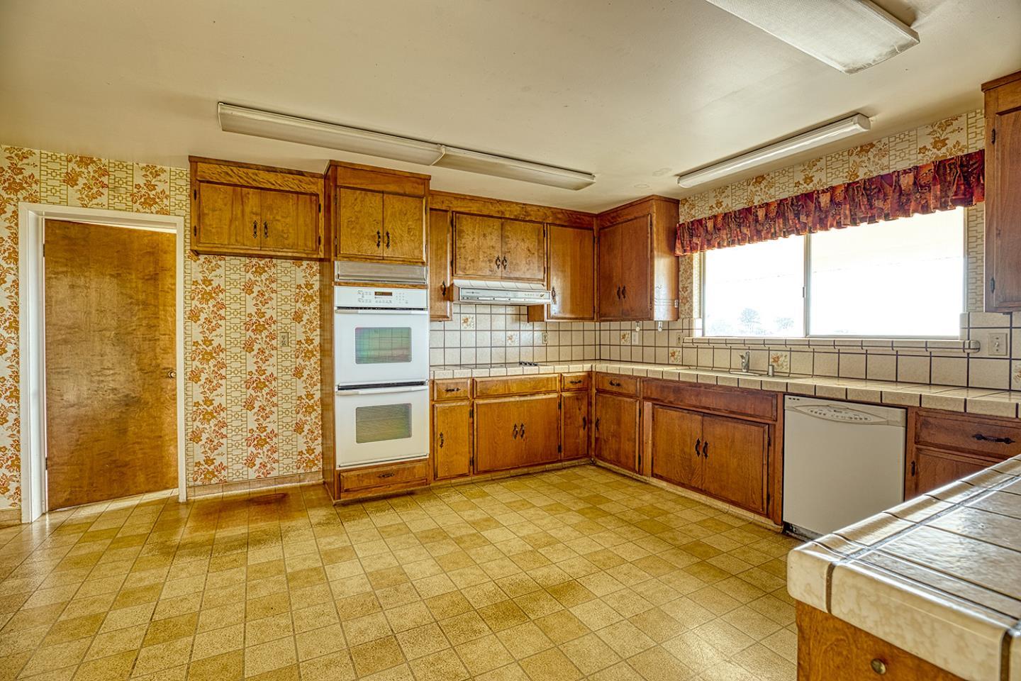 21 Lilly Way Watsonville, CA 95076 - Photo 22 of 47 a kitchen with stainless steel appliances granite countertop a stove and a refrigerator