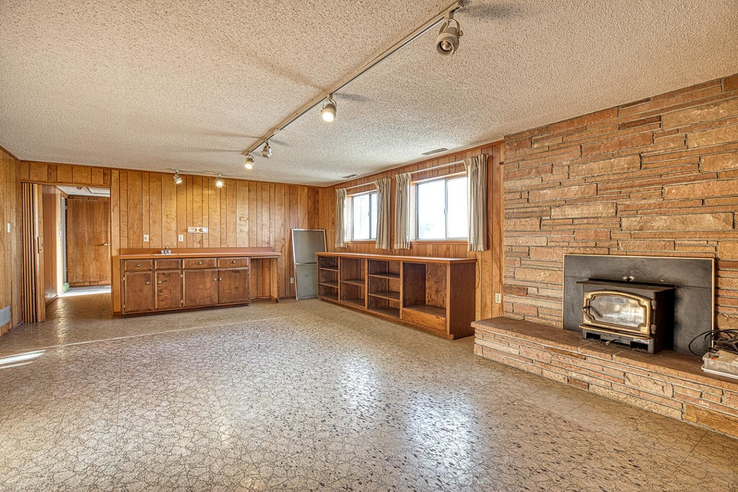 21 Lilly Way Watsonville, CA 95076 - Photo 25 of 47 a view of an empty room with a fireplace and a window