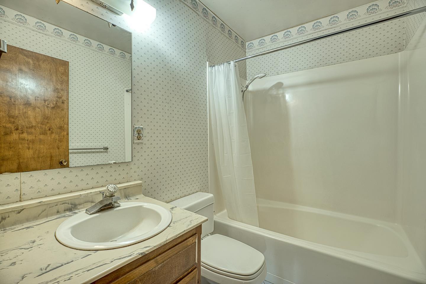 21 Lilly Way Watsonville, CA 95076 - Photo 36 of 47 a bathroom with a granite countertop sink toilet and shower