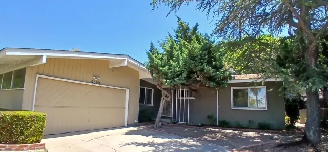 a front view of a house with a garage